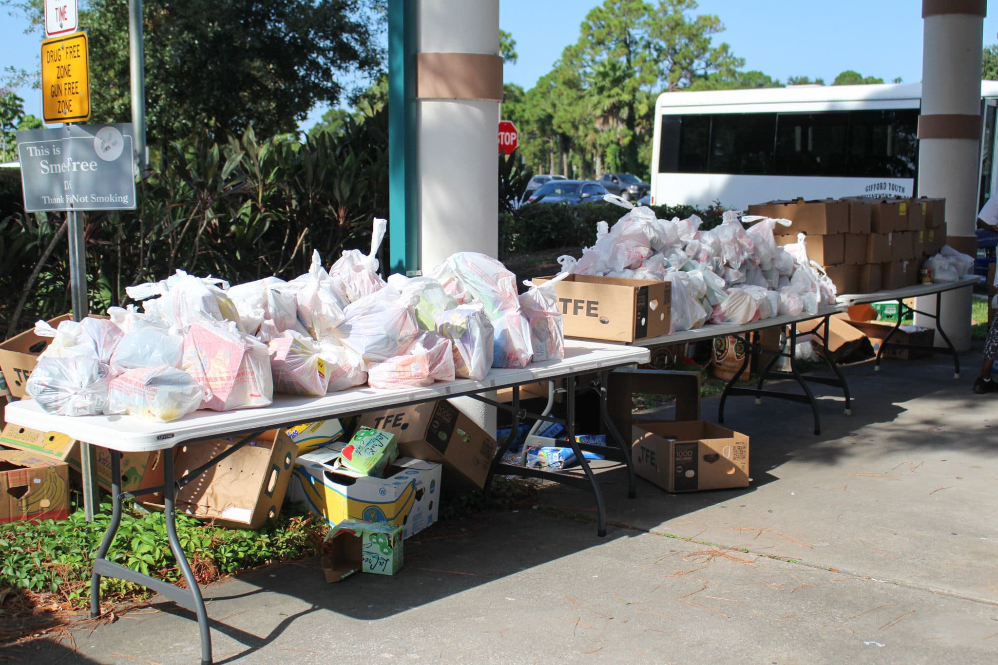 Food items in plastic bags displayed on table at GYAC's Mobile Food Pantry