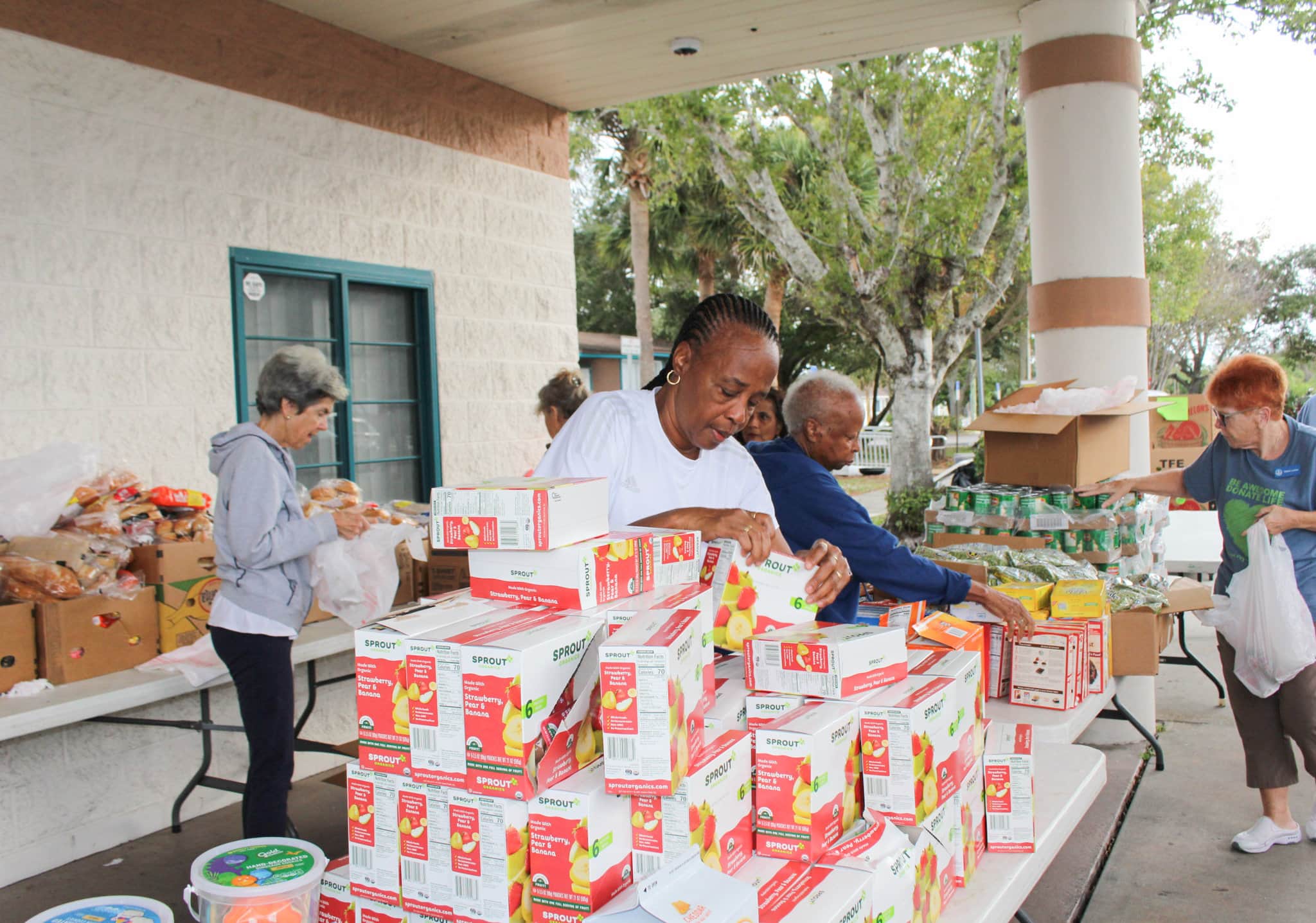 GYAC's Mobile Food Pantry volunteers pack bags for food distribution on December 13, 2023.